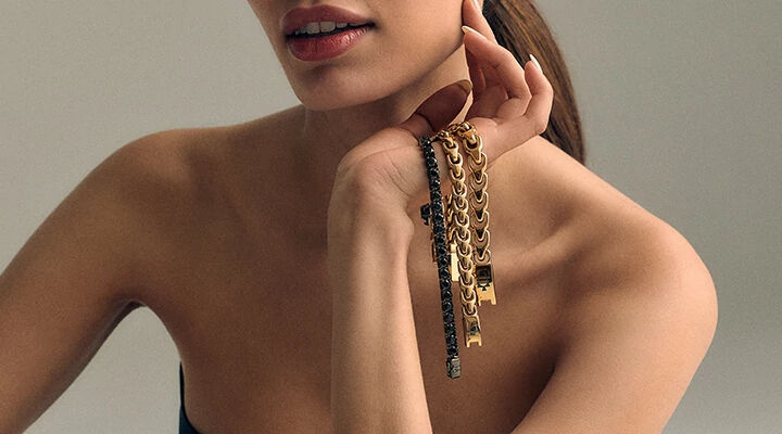 Woman Holding 3 Bulova Link Bracelets