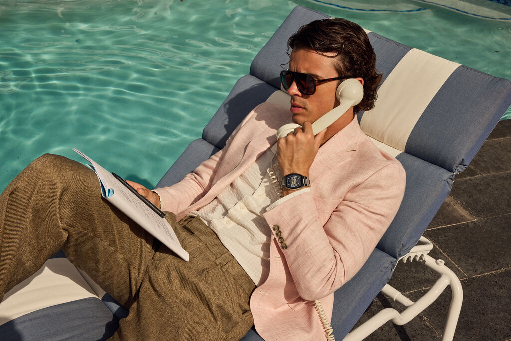 Man Sitting by the Pool Wearing Bulova Maquina Watch 98A319