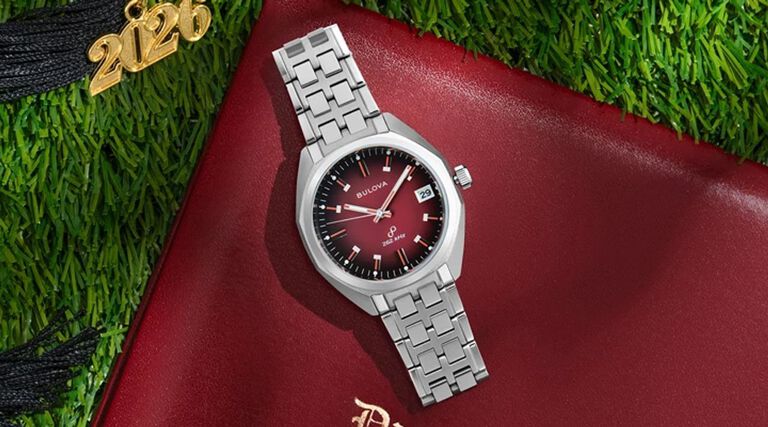 Graduation Watch Gifts for Him and Her; Featuring an image of Jet Star watch model 96B401 on a grass background with a graduation cap and diploma