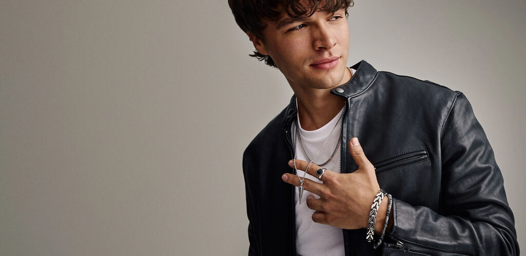 Man Wearing Bulova Bracelets, Rings and Pendant