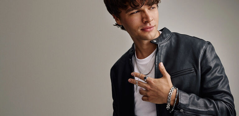 Man Wearing Bulova Bracelets, Rings and Pendant