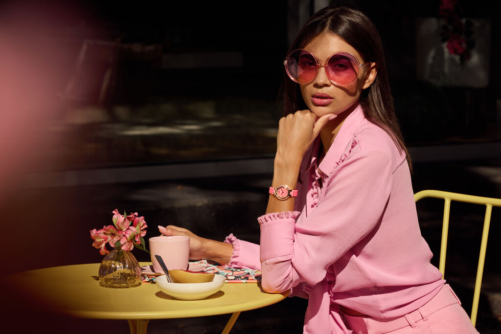Woman Sitting at a Table Wearing Spring Rubaiyat Bulova Watch
