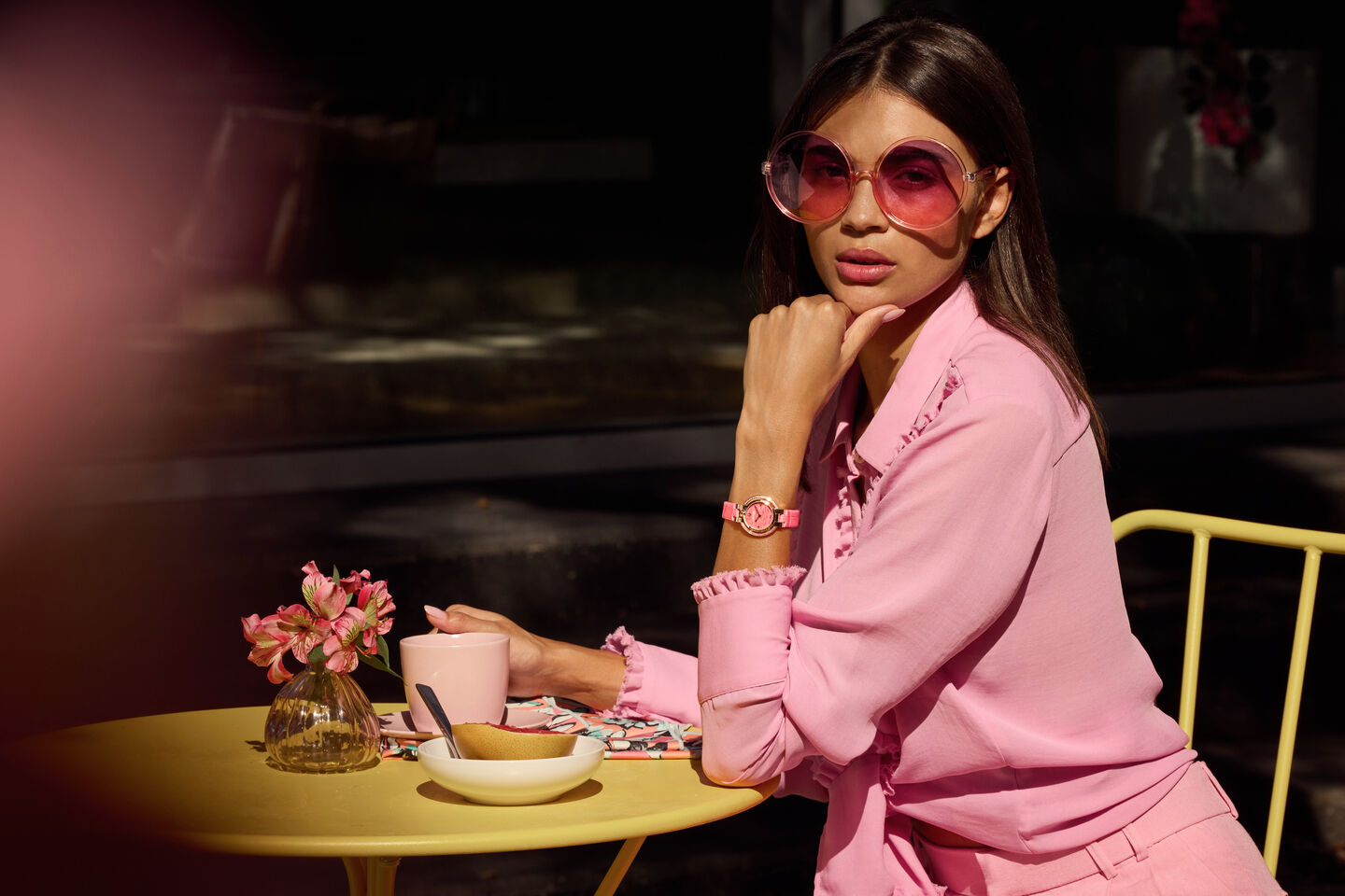 Woman Sitting at a Table Wearing Spring Rubaiyat Bulova Watch