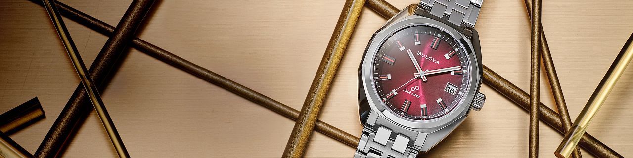 Jet Star Watches; Featuring an image of Jet Star model 96B401 on a gold print background