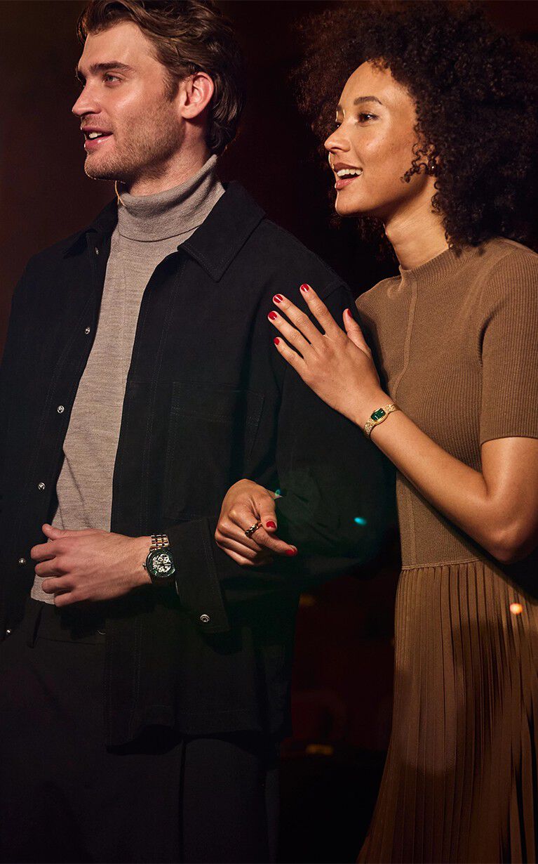 Couple wearing the Goddess of Time watch Model 97L184 and Sutton Watch Model 96A329